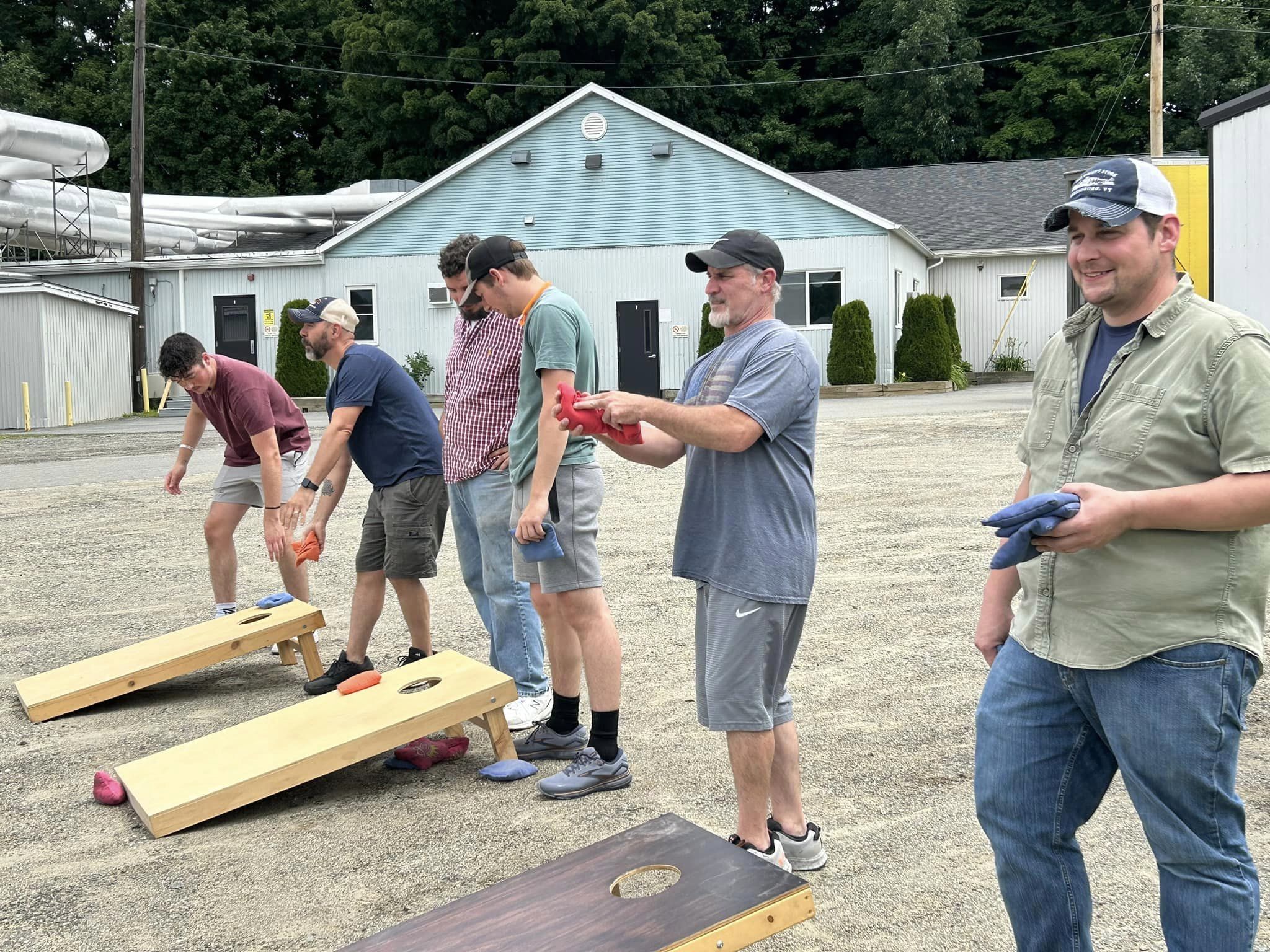 Employees playing cornhole